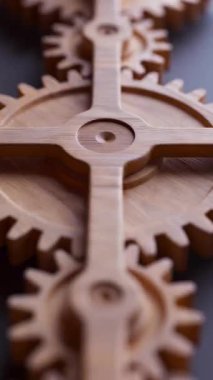 Ahşap dişlilerden yapılmış mekanik bir yapının animasyonu. Döngüsel hareket. Yakın plan. Dikey kompozisyon. Odaklanmayın.
