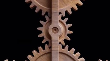 Ahşap dişlilerden yapılmış mekanik bir yapının animasyonu. Alfa Kanalı. Döngüsel hareket. Yatay bileşim.