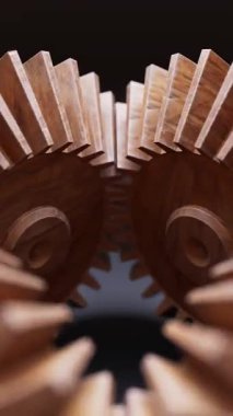 Ahşap dişlilerden yapılmış mekanik bir yapının animasyonu. Döngüsel hareket. Yakın plan. Dikey kompozisyon. Odaklanmayın.