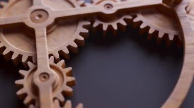 Ahşap dişlilerden yapılmış mekanik bir yapının animasyonu. Döngüsel hareket. Yakın plan. Yatay bileşim. Odaklanmayın.