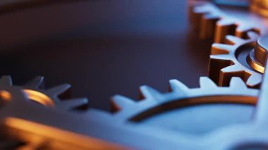 Metal dişlilerden yapılmış mekanik bir yapının animasyonu. Döngüsel hareket. Yakın plan. Yatay bileşim. Odaklanmayın.