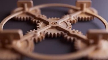 Ahşap dişlilerden yapılmış mekanik bir yapının animasyonu. Döngüsel hareket. Yakın plan. Yatay bileşim. Odaklanmayın.