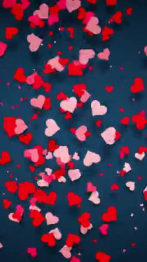 Pembe ve kırmızı kalplerin döngülü animasyonu koyu mavi arka planda dairesel bir akış içinde hareket ediyor. Romantik projeler, arka planlar ve aşk temalı kutlamalar için mükemmel. Döngü Canlandırması.