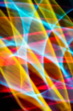 A Neon Wavy Light Nightclub Background Swirls on Black Background