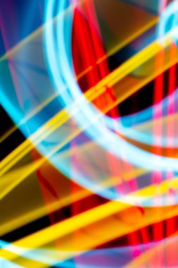 A Neon Wavy Light Nightclub Background Swirls on Black Background