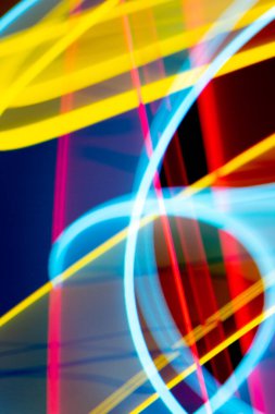 A Neon Wavy Light Nightclub Background Swirls on Black Background