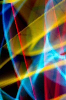 A Neon Wavy Light Nightclub Background Swirls on Black Background