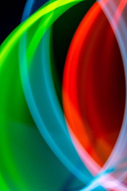 A Neon Wavy Light Nightclub Background Swirls on Black Background