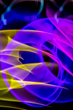 A Neon Wavy Light Nightclub Background Swirls on Black Background