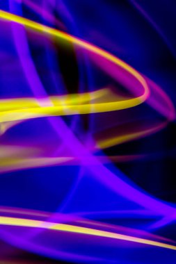 A Neon Wavy Light Nightclub Background Swirls on Black Background