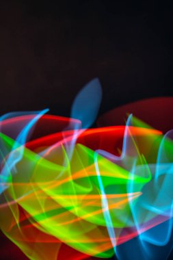 A Neon Wavy Light Nightclub Background Swirls on Black Background