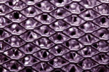 A Wire Mesh Close Up Steel Surface for Background In Purple Pink