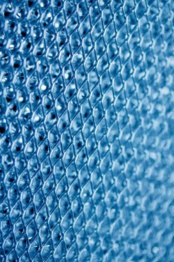 A Wire Mesh Close Up Steel Surface for Background in Blue