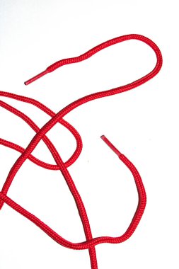 A Close Up of Red Shoe Lace Fabric on a White Background