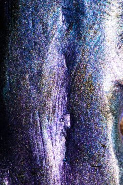 shiny background with dimples and slightly textured made from mica powder on clay