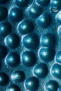 A Alien trypophobia holes in a shiny sci-fi close up background