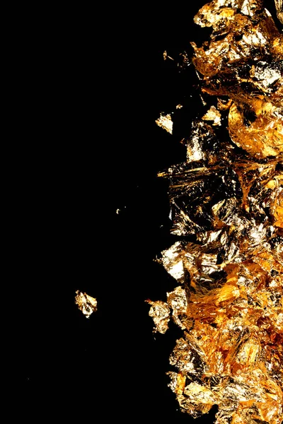 Vibrant Gold Leaf Pieces Close Up on A Background as Decorative Pieces
