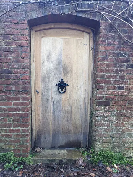A Antique Historic Secret Door in a Stone Wall