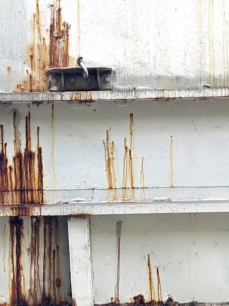 A Rusty Metal Silo Building Close Up With Water Lines