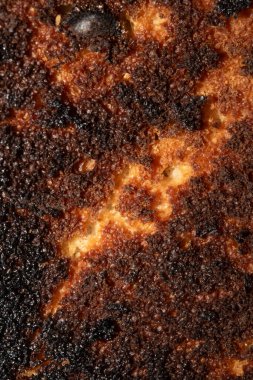 Çok yanmış bir ekmek rulosu Yakın çekim dokusu