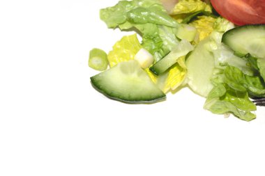 Close up of a healthy cold salad chopped tomatoes and cucumbers on a whiite background clipart