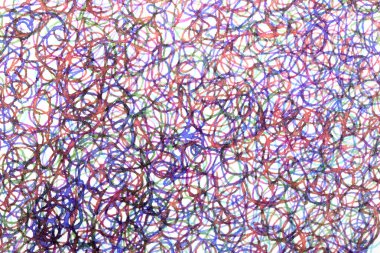 Coloured ink pen scribbled wavy messy tengled lines on white background