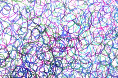 Coloured ink pen scribbled wavy messy tengled lines on white background