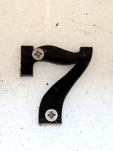 Written Wording in Distressed State Typography Found Ransom Number 7 Seven