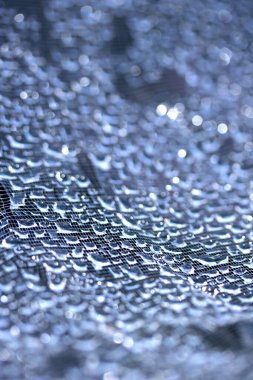 Dantel çizgilerdeki soyut su damlacıkları yumuşak ve güzel arkaplanı doldurur