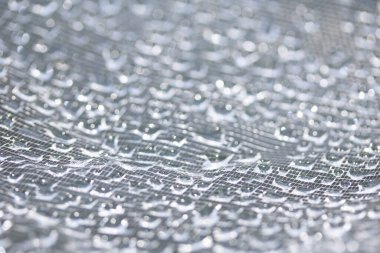 Dantel çizgilerdeki soyut su damlacıkları yumuşak ve güzel arkaplanı doldurur