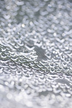 Dantel çizgilerdeki soyut su damlacıkları yumuşak ve güzel arkaplanı doldurur