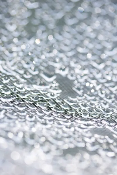 Dantel çizgilerdeki soyut su damlacıkları yumuşak ve güzel arkaplanı doldurur