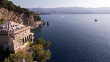 Experience the beauty of a coastal villa near Portofino, surrounded by serene waters and lush mountains, perfect for relaxation and stunning views.