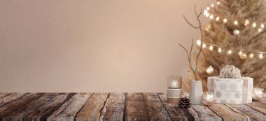 Mumlar ve Noel ağacı da dahil, rahat bir masa üstü dekorasyonuyla huzurlu bir tatil ortamı için mükemmel bir ortam..