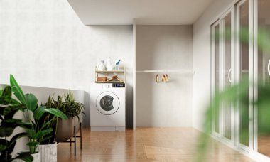 Modern bir çamaşırhane, çamaşır makinesi ve dekoratif bitkilerle donatılmış, çağdaş tasarımı vurgulayan şık bir iç mekan..