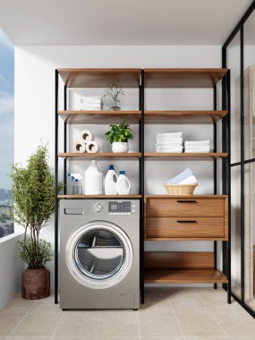 Gri bir çamaşır makinesinin modern rafların ve yeşilliklerin arka planında yer aldığı gösterişli bir ev çamaşır odası..