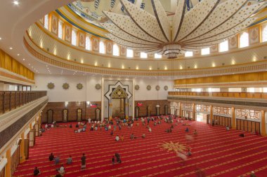 Mataram, 28 July 2021, Islamic center Lombok, Indonesia. Grand Mosque Interior Showcases Prayer Hall, Dome, and Ornate Chandelier with Architectural Details Beautifully. clipart