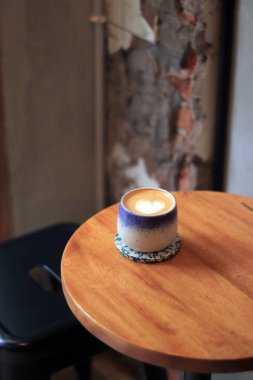 Heart Latte Art Sits Beautifully on a Cafe Table, Cozy Coffee Shop Atmosphere clipart