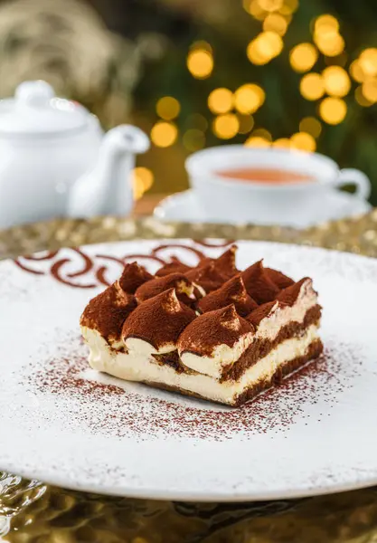 Christmas Cake Tiramisu Sprinkled Powdered Cocoa Background Cup Tea Bokeh — Stock Photo, Image
