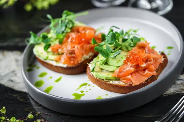 Sandwiches Cream Cheese Avocado Slices Salmon Red Fish Caviar Microgreens — Stock Photo, Image