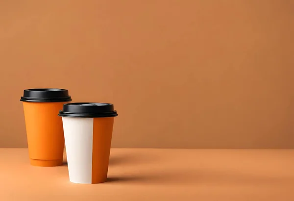 Paper cup of coffee on the table. Coffee paper cup mockup. isolated on orange background, v6