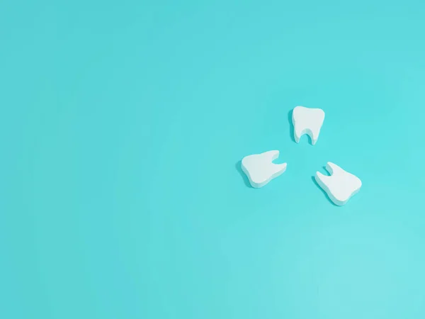 Photo tooth on a blue background with white teeth