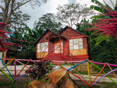 Beautiful and colorful cabin at the La Mano del Gigante viewpoin in Huila - Colombia clipart