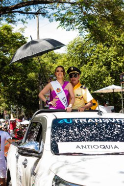 Neiva, Huila, Colombia - June 27, 2024 - White Latina woman posing and looking at the camera in a parade of San Juan and San Pedro clipart