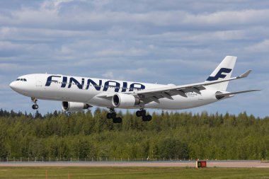 Helsinki, Finland - June 5, 2023: Airbus A330-300 of finnish hub airline Finnair on arrival in the air clipart