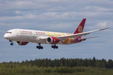 Helsinki, Finland - June 5, 2023: Juneyao Air from China with modern aeroplane Boeing 787-9 Dreamliner clipart