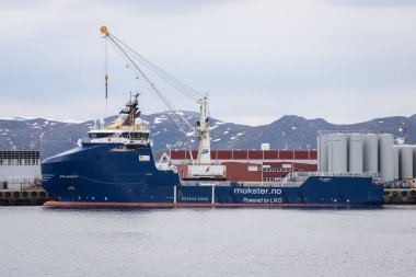 Hammerfest, Norway - June 11, 2023: Offshore supply ship Stril Barents in the industrial port of Hammerfest in Norway clipart