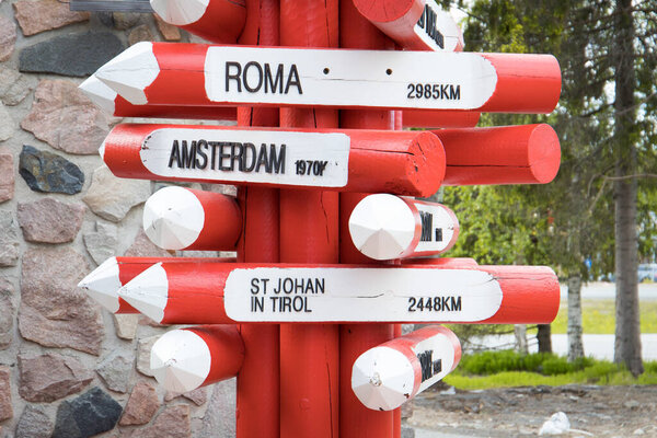 Waymarker in Rovaniemi, Lapland in Finland,  showing way and distance to places in europe
