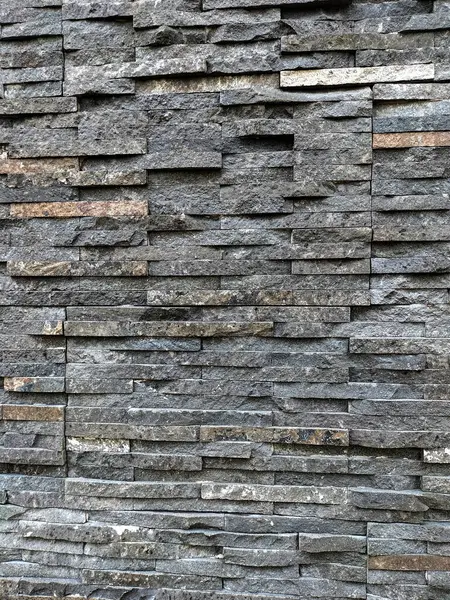 Natural stone texture on the wall. Selective focus.