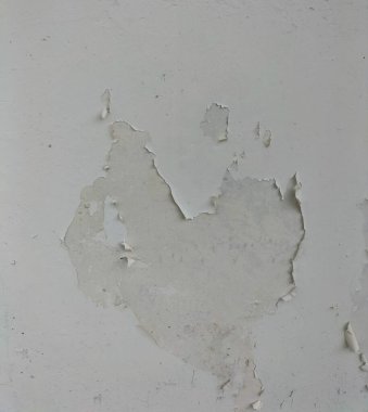 Soyulma, yıpranma ve hasar görmüş beton duvar renginin yakın görüntüsü. Soyut. Geçmişi. Seçici odak. 